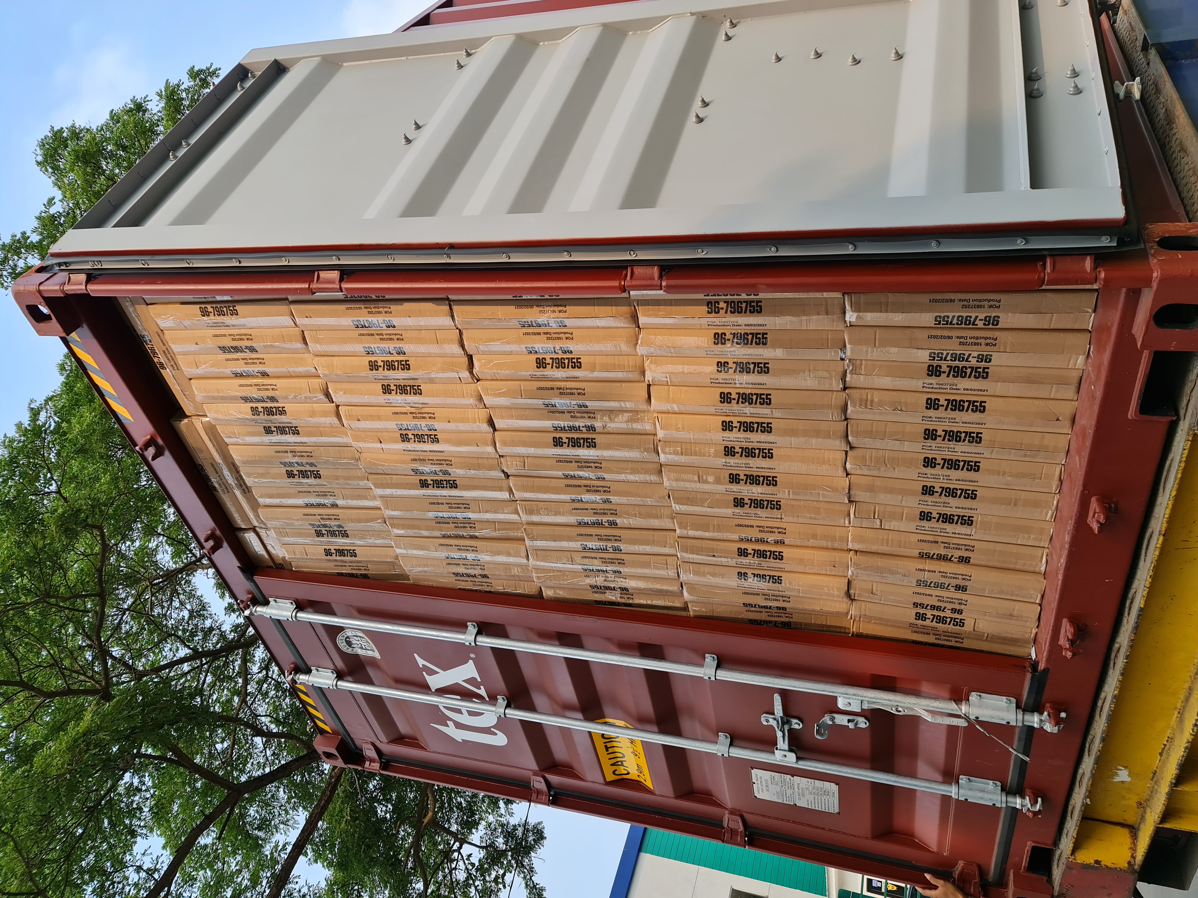 Export container fully loaded floor-to-ceiling with PT Glory Offset Press cartons, ready to ship to US retailers